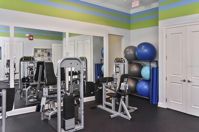 exercise room featuring ornamental molding