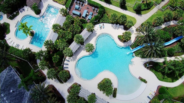 view of pool with a patio and a water slide