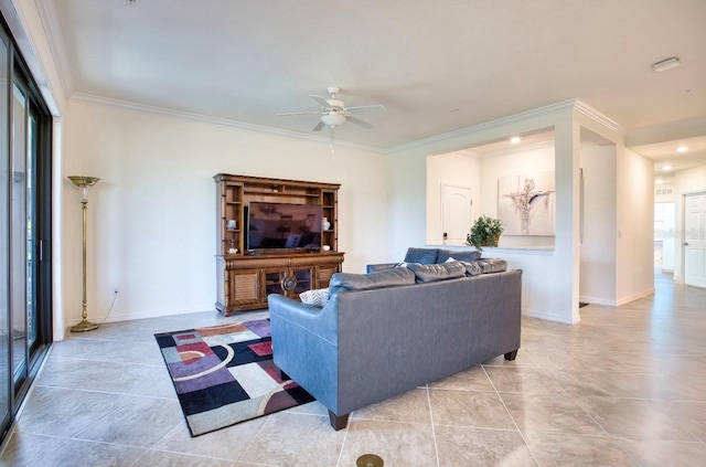 living area featuring ornamental molding, light tile patterned floors, baseboards, and a ceiling fan