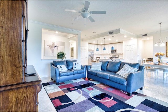 living area featuring visible vents, crown molding, baseboards, and ceiling fan with notable chandelier