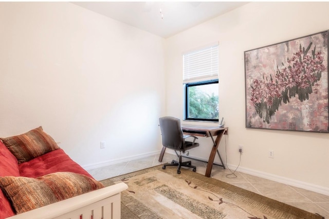 office space with tile patterned flooring and baseboards