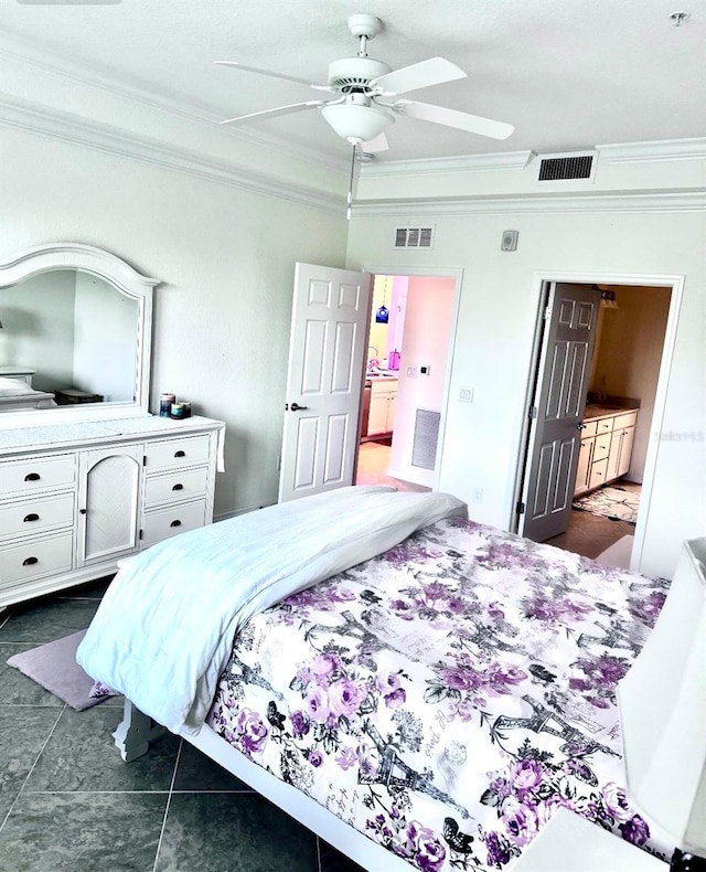 bedroom with dark tile patterned flooring, visible vents, and crown molding