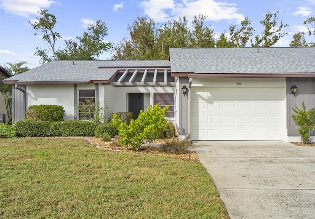 single story home with a front lawn and a garage