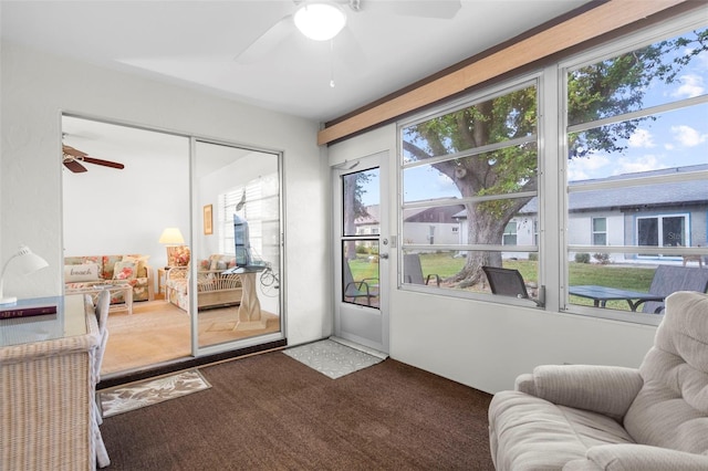 entryway with carpet flooring and ceiling fan