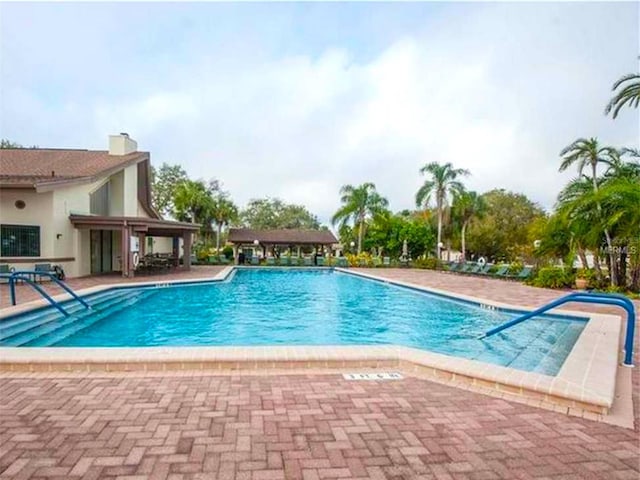 view of swimming pool featuring a patio