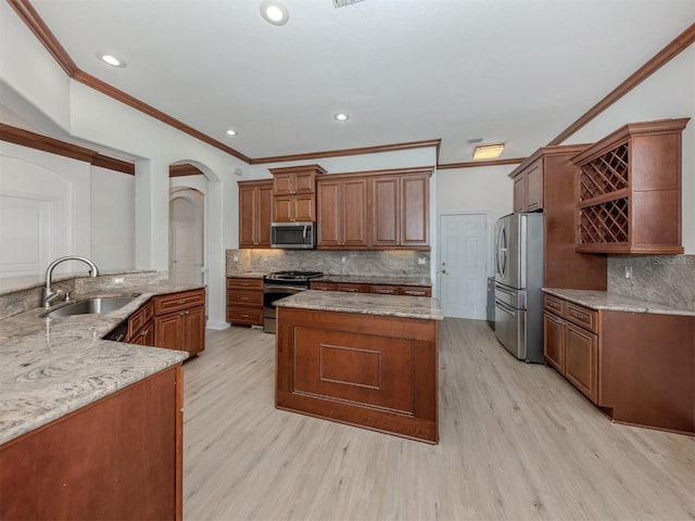 kitchen featuring light stone countertops, sink, light hardwood / wood-style flooring, appliances with stainless steel finishes, and ornamental molding