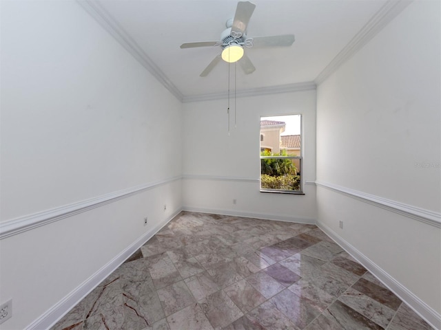 empty room featuring ceiling fan and ornamental molding