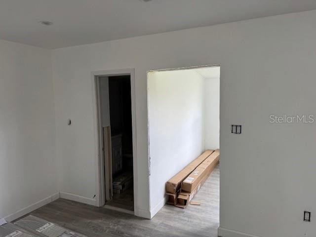 spare room featuring dark hardwood / wood-style flooring