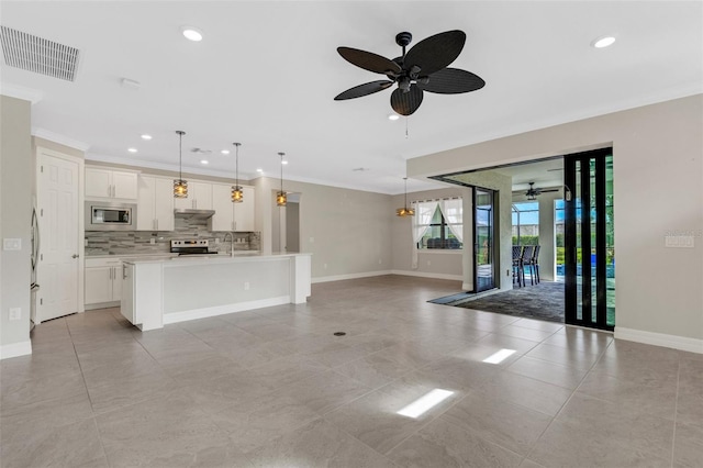 unfurnished living room featuring light tile patterned flooring, ceiling fan, crown molding, and sink