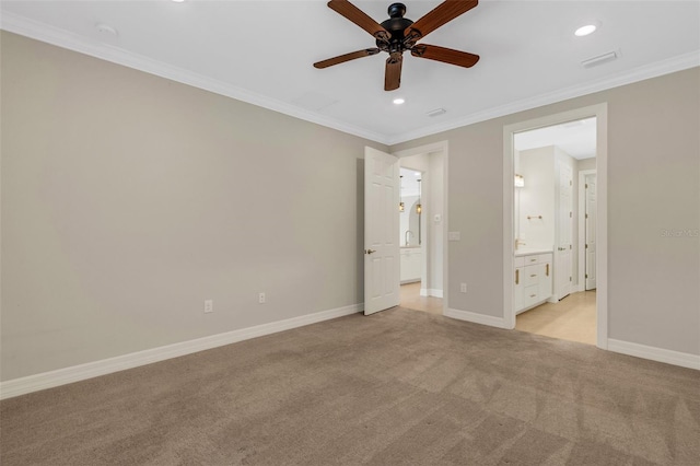 unfurnished bedroom featuring ceiling fan, light colored carpet, ornamental molding, and connected bathroom