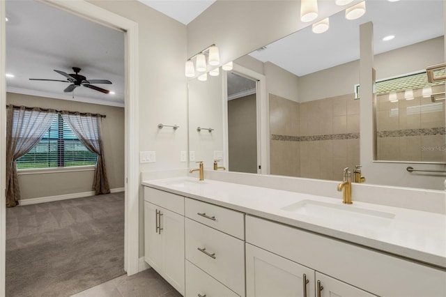 bathroom featuring vanity, tile patterned flooring, ceiling fan, ornamental molding, and tiled shower