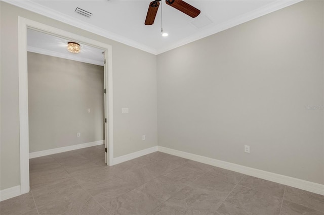 spare room featuring ceiling fan and ornamental molding