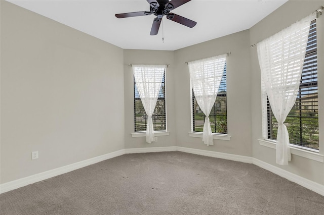 empty room with carpet and ceiling fan