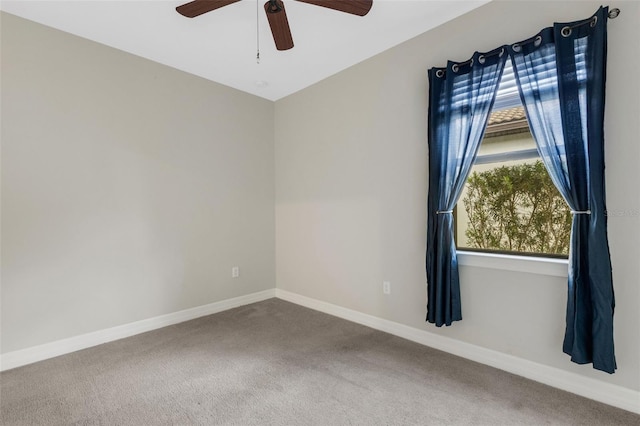 carpeted empty room with ceiling fan