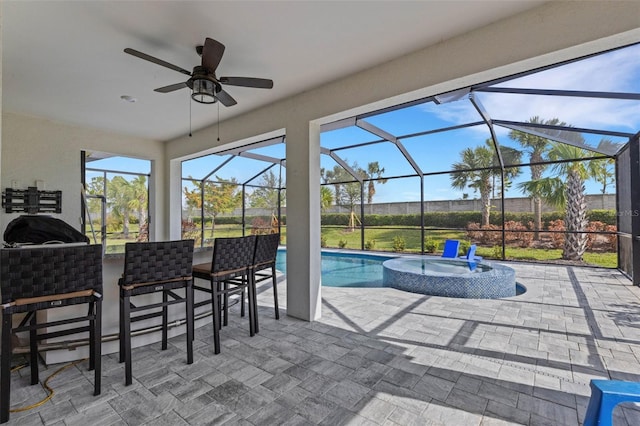 view of patio / terrace with glass enclosure and ceiling fan