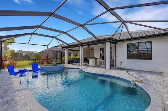 view of pool featuring an outdoor bar, ceiling fan, a lanai, area for grilling, and a patio