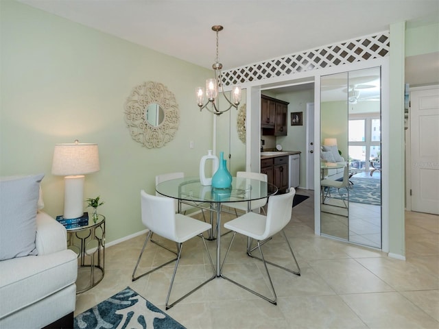 dining area with an inviting chandelier and light tile patterned floors