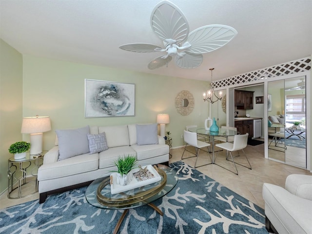 living room featuring ceiling fan with notable chandelier and light tile patterned floors