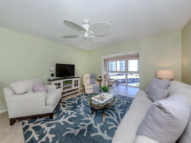 tiled living room with ceiling fan