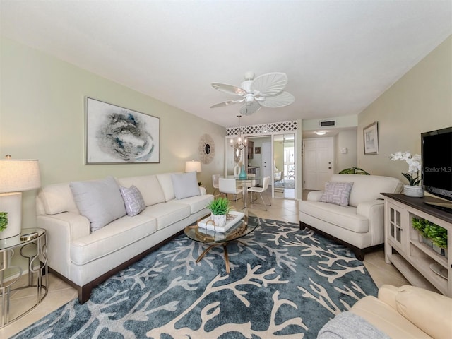 living room featuring light tile patterned floors and ceiling fan