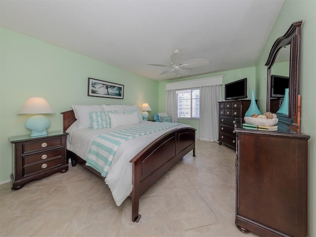 tiled bedroom with ceiling fan