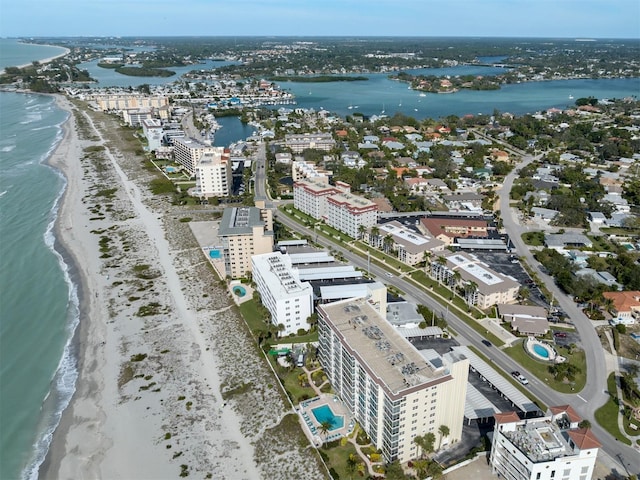 aerial view with a water view and a beach view