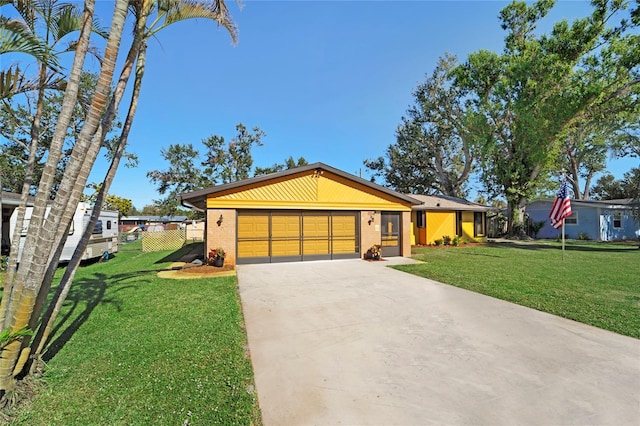 ranch-style house with a front yard and a garage