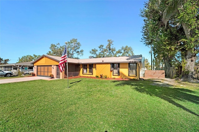 ranch-style house with a front yard and a garage