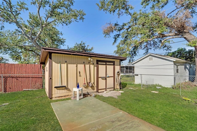 view of outdoor structure featuring a lawn