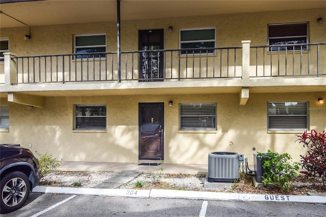 view of property featuring central AC unit