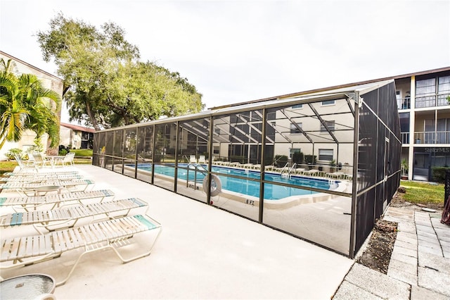 view of pool with a lanai and a patio area