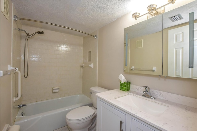 full bathroom with tiled shower / bath combo, toilet, a textured ceiling, and vanity