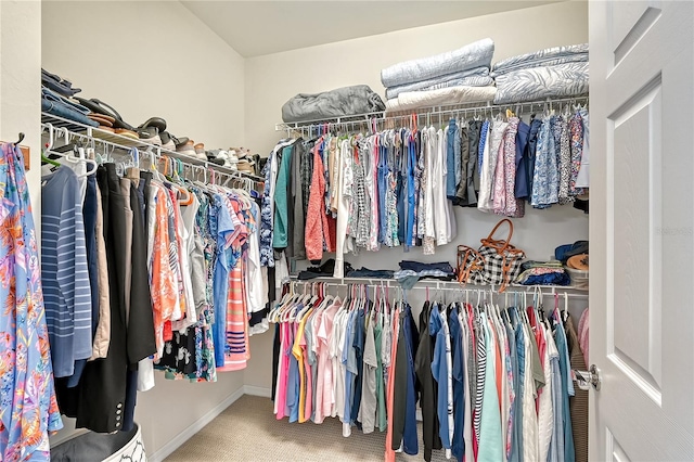 spacious closet with carpet flooring