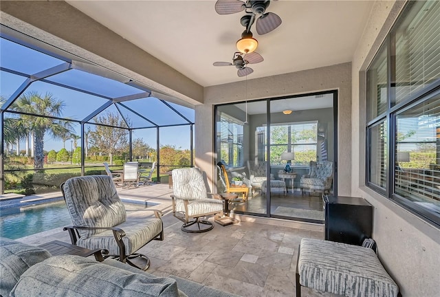 view of patio / terrace with glass enclosure and ceiling fan