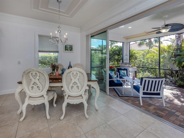 dining area featuring ceiling fan with notable chandelier and crown molding