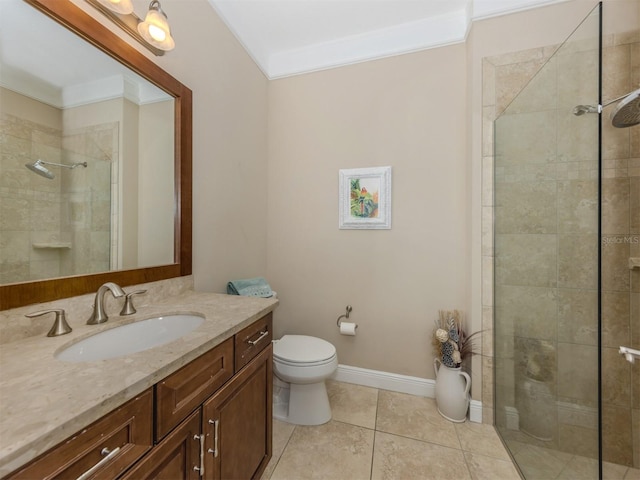 bathroom featuring tile patterned floors, vanity, toilet, and ornamental molding