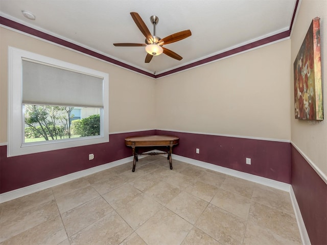 unfurnished room with ceiling fan and ornamental molding