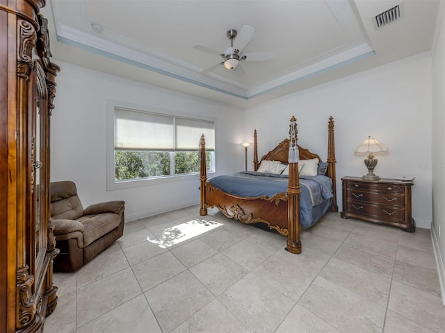 bedroom with ceiling fan, light tile patterned floors, crown molding, and a tray ceiling