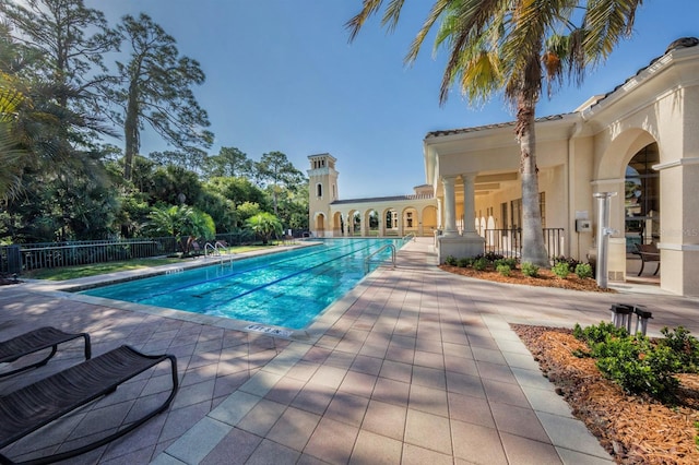 view of swimming pool featuring a patio area