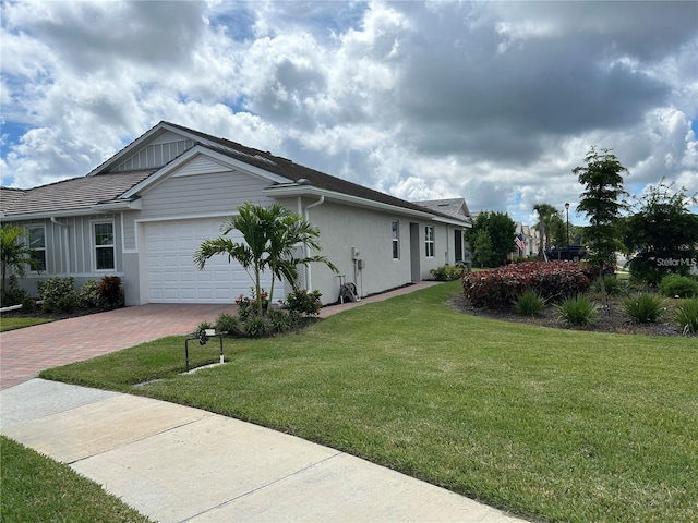 view of home's exterior featuring a garage and a yard