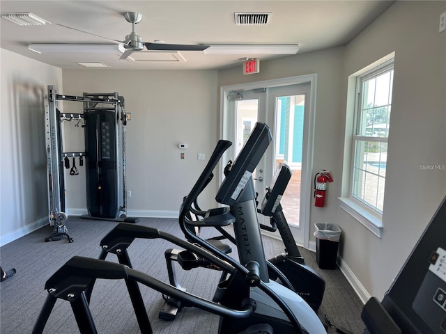 exercise room with plenty of natural light, visible vents, and baseboards