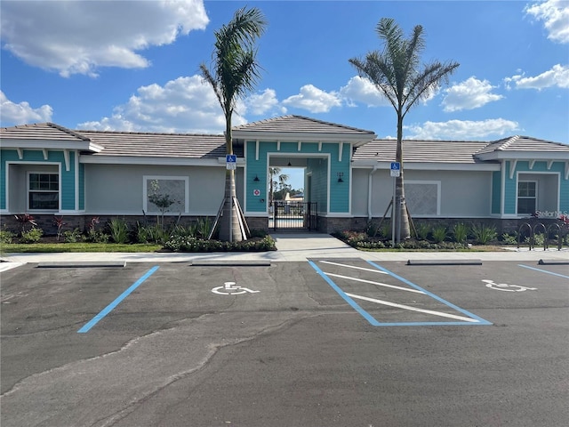 view of property featuring uncovered parking