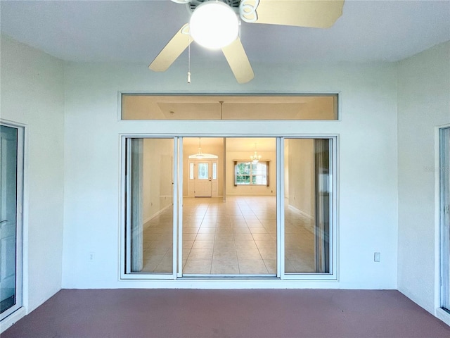 interior space featuring ceiling fan