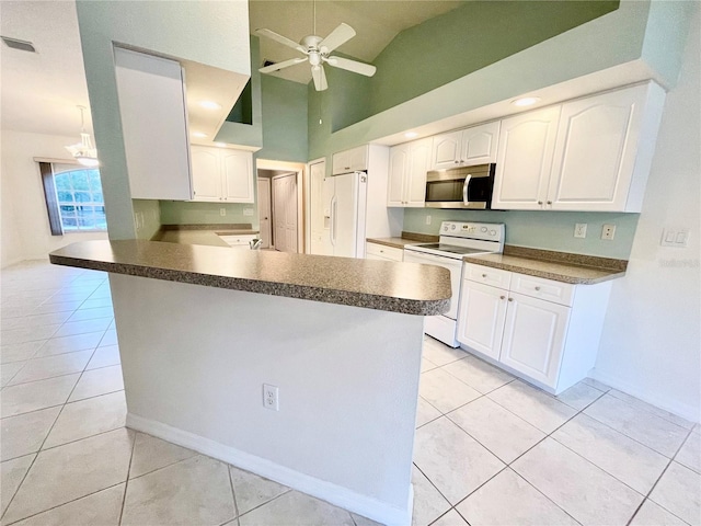 kitchen featuring white appliances, white cabinetry, light tile patterned flooring, ceiling fan with notable chandelier, and kitchen peninsula