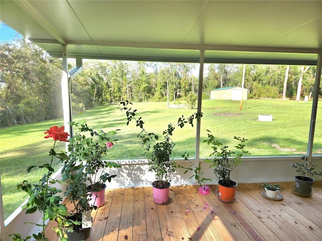 unfurnished sunroom featuring a wealth of natural light