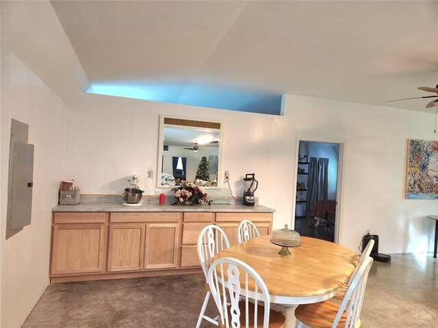 dining area with ceiling fan and electric panel