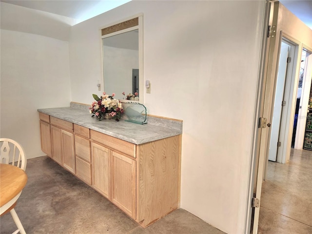 bathroom with concrete flooring