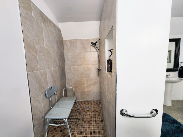 bathroom featuring tiled shower and tile patterned floors