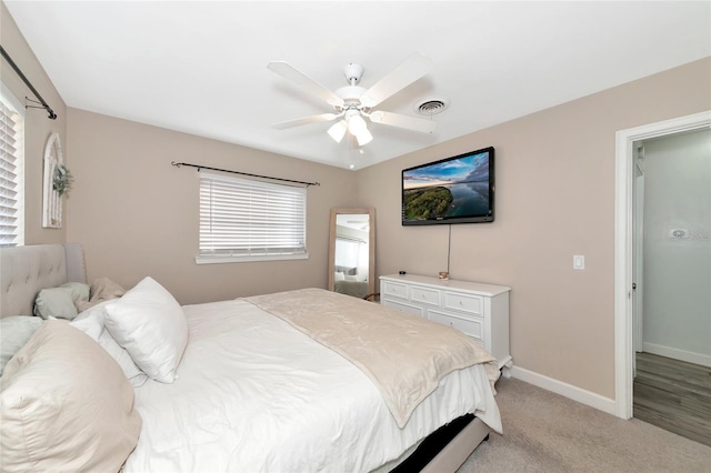 carpeted bedroom with ceiling fan