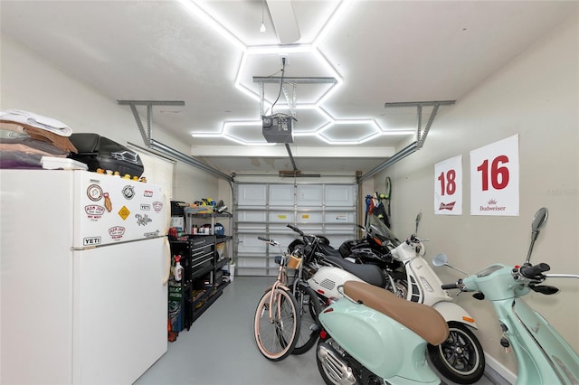 garage featuring a garage door opener and white refrigerator